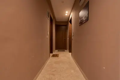 a hallway with a door and a tile floor at Le Vintage Dead Sea in Casablanca