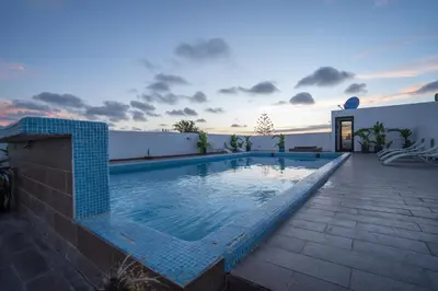 a swimming pool on the roof of a house at Le Vintage Dead Sea in Casablanca