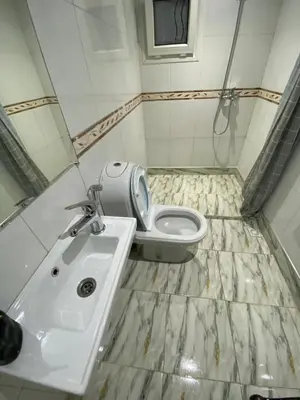 a bathroom with a toilet and a sink at Appartement de lux in Casablanca