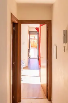 a hallway with a door open to a room at Terrasses de Marrakech- Au coeur de Casablanca in Casablanca
