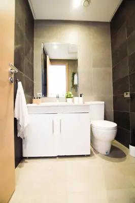 a bathroom with a white sink and a toilet at YourPlace - Prestigia - Hay Riad in Rabat