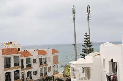 a row of buildings with the ocean in the background at appartement de luxe front mer à DAR BOUAAZA in Dar Bouazza