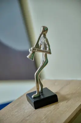 a statue of a person dancing on a table at YourPlace Rabat Agdal 1 - Cozy Residence in Rabat