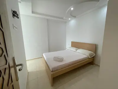 a small bedroom with a bed in a room at Cozy Apartment in Rabat