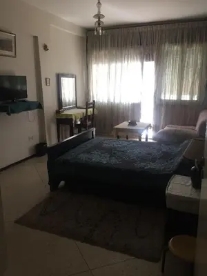 a bedroom with a large bed and a window at Property located in a quiet area close to the train station and town in Casablanca