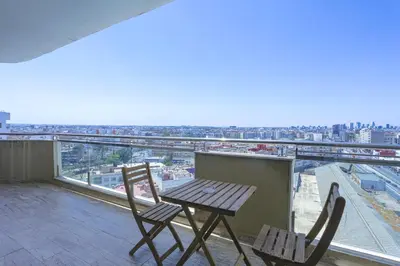 a table and chairs on a balcony with a view at W-Aldorf in Casablanca