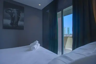 a bedroom with a bed and a window with an elephant at W-Aldorf in Casablanca