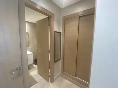 a bathroom with a walk in shower and a glass door at Luxueux Appartement avec Vue Panoramique, Proche de la Gare WELCOME STAY in Casablanca