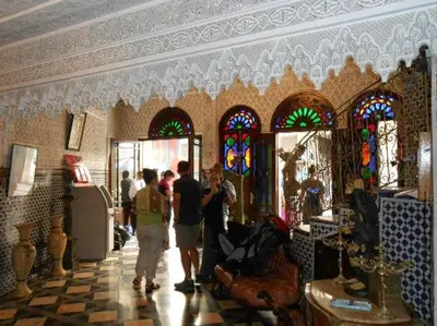 a group of people standing in a room with stained glass at HOTEL AL MAMOUN in Casablanca
