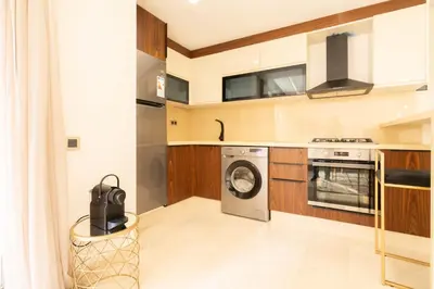 a kitchen with a washer and dryer in it at Fresh maarif flat in new building in Casablanca