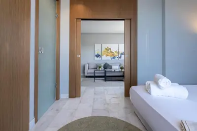 a room with two beds and a living room at c4 .super appartement with parking in Casablanca