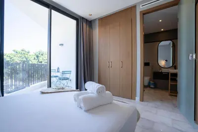 a bedroom with a bed with white towels on it at c4 .super appartement with parking in Casablanca