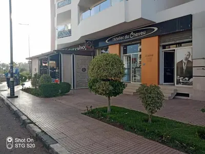 a building with a tree in front of it at Appartement la perle de Nouaceur in Nouaceur