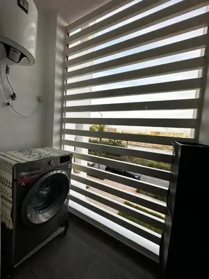 a washing machine in a room with a window at Ocean Palm Aρραrt Pοοl Vieω in Casablanca