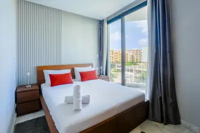 a bedroom with a bed with a large window at Amazing view Fast WiF with Gym near tramway in Casablanca