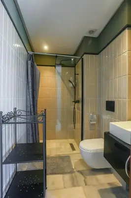 a bathroom with a shower and a toilet and a sink at Amazing view Fast WiF with Gym near tramway in Casablanca