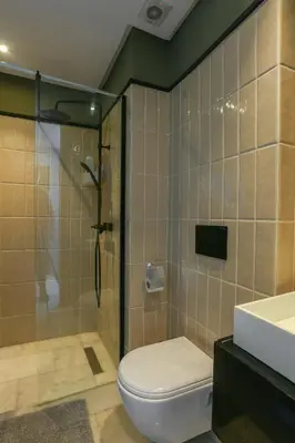 a bathroom with a shower and a toilet and a sink at Amazing view Fast WiF with Gym near tramway in Casablanca