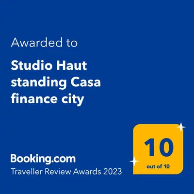 a yellow sign that says studio hon standing case finance city at Magnifique appartement Casa Finance City in Casablanca