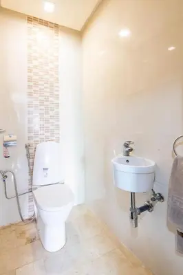 a bathroom with a toilet and a sink at Layover Guest House Apartment & parking Rabat Agdal City Center in Rabat
