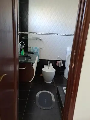 a small bathroom with a toilet and a sink at Villa de rêves in Casablanca