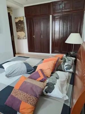 a bedroom with a bed with pillows on it at Villa de rêves in Casablanca