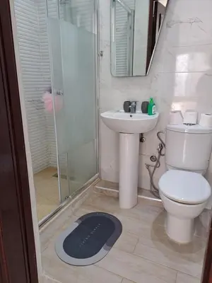 a bathroom with a toilet and a sink and a shower at Villa de rêves in Casablanca