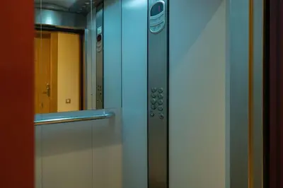 a glass door with a mirror in a bathroom at Hot location flat at Maarif bd Anfa near Ahmet chef in Casablanca