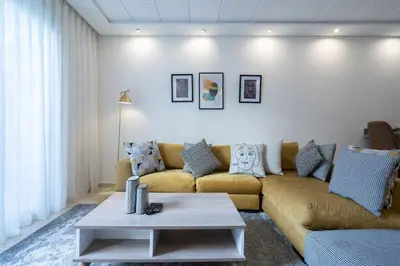 a living room with a couch and a table at Hot location flat at Maarif bd Anfa near Ahmet chef in Casablanca