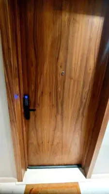 a wooden door with a phone on it at Superbe Appartement avec piscine et jacuzzi privé in Casablanca