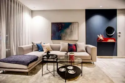 a living room with a couch and a table at Upscale flat with Gym in Casablanca