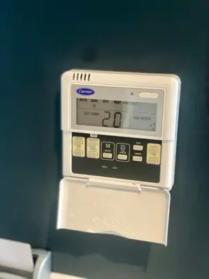 a clock in a box hanging on a wall at Upscale flat with Gym in Casablanca