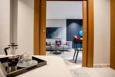 a living room with a couch and a table at Upscale flat with Gym in Casablanca