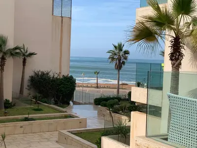 a view of the beach from a building at Appartement de standing vue sur mer à Mohammedia in Mohammedia
