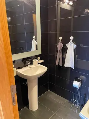 a bathroom with a sink and a mirror at Superb Apartment on 14th floor with Jacuzzi in Casablanca