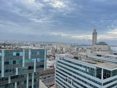 a view of a city with a clock tower at Superb Apartment on 14th floor with Jacuzzi in Casablanca