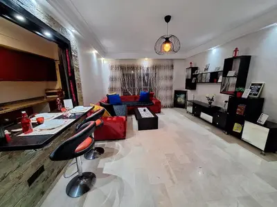 a large living room with a couch and a table at Zen Home in Casablanca