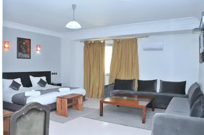 a living room with a bed and a couch at EAST WEST HOTEL in Casablanca