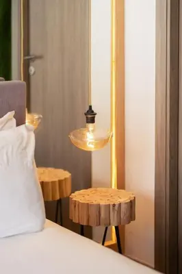 a bedroom with a bed with a lamp and two tables at Metropolitan 06-Two Bedrooms - Cavalli Luxury Flat in Casablanca