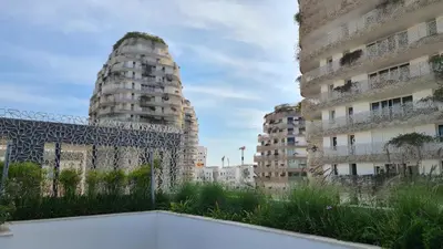 a view of two tall buildings in a city at Duplex Rooftop d'exception terrasse panoramique de 100 m2 in Casablanca