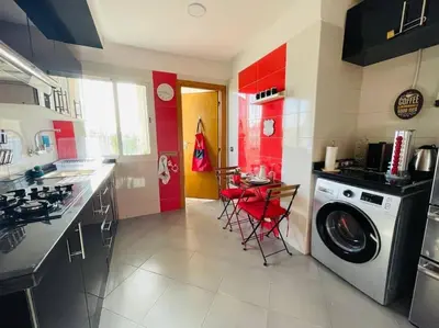 a kitchen with a washer and a washing machine at A 2 minutes de Casa Finance City, appartement avec 2 Chambres in Casablanca
