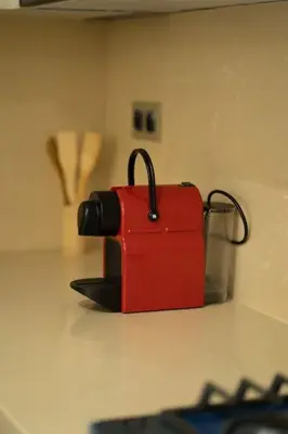 a red bag sitting on top of a counter at New upscale central maarif flat in Casablanca