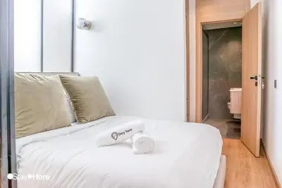 a white bed with a scale on top of it at Stayhere Casablanca - Gauthier 1 - Modern Residence in Casablanca