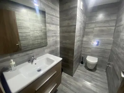 a bathroom with a sink and a toilet at Luxueux appartement avec vue panoramique WELCOME STAY in Mohammedia
