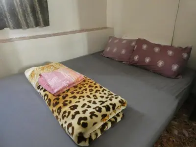 a bed in a room with two pillows on it at Booking and hosting medina in Casablanca