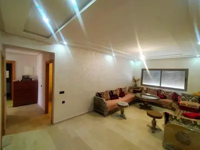 a living room with a couch and a table at 3 Bedroom Apartment with Wifi in Casablanca