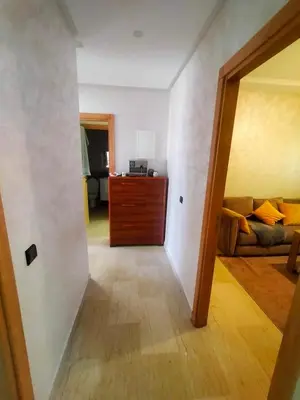 a hallway with a living room with a couch at 3 Bedroom Apartment with Wifi in Casablanca
