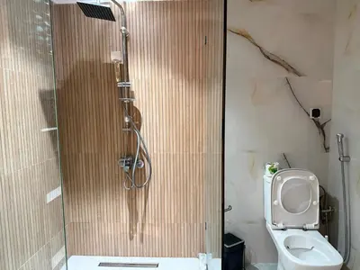 a bathroom with a shower and a toilet at Appt 1 ch salon for saison in Rabat