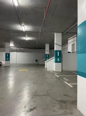 an empty parking garage with columns in a parking lot at Marina Casa Del Mar - Amazing Sea & Mosque views in Casablanca
