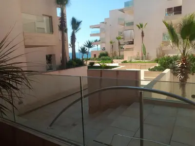 a view from the balcony of a building with palm trees at Apparemment Rockisland in Mohammedia