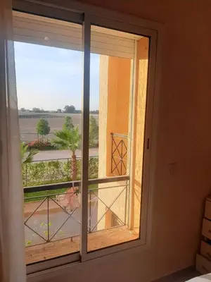 a window in a room with a view of a field at Ricoflores PALM in O Ben Slimane